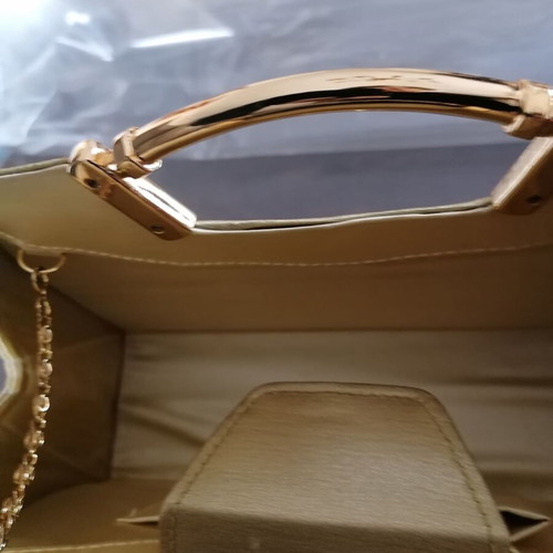 Small gold handbag with handle and long chain, like new