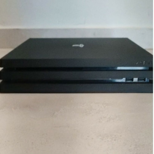 PlayStation 4 Pro 1TB console used with controller and FIFA 21 game