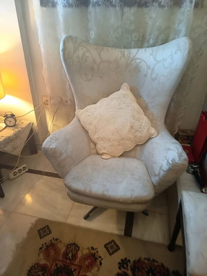 Armchair used with beige brocade fabric swivel
