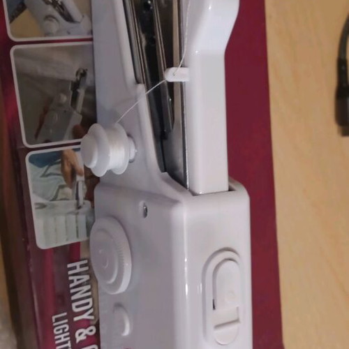 Handheld sewing machine like new