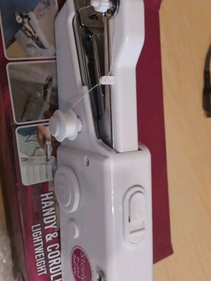 Handheld sewing machine like new