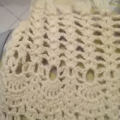 Knitted scarf handmade in soft yellow color with fringes
