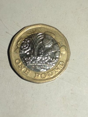 New British £1 coin used, polygonal shape