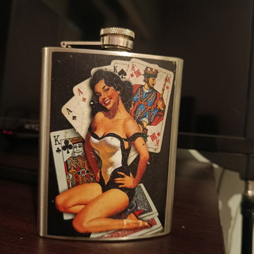 Vintage flask with pin-up design used, stainless steel
