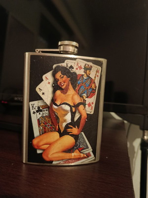 Vintage flask with pin-up design used, stainless steel