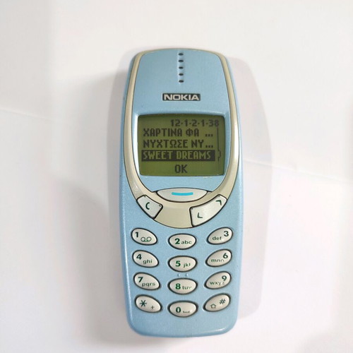 Nokia 3330 phone used with charger and buttons