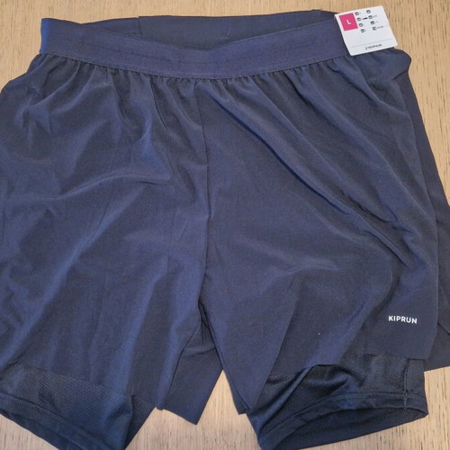 Kiprun shorts with compression lining new, size Large, black