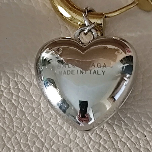Balenciaga earrings with two tone dangling hearts like new