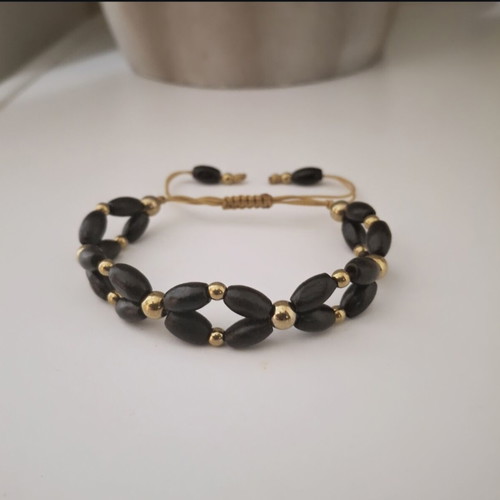 Bracelet with black wooden beads and gold details adjustable, new
