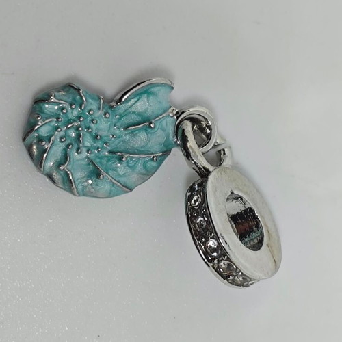 Silver charm with blue enamel Nautilus like new