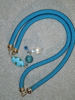 Blue long necklace made of cord and beads like new
