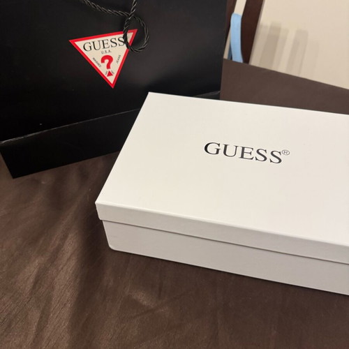 Guess white shoulder bag used with embossed logo pattern