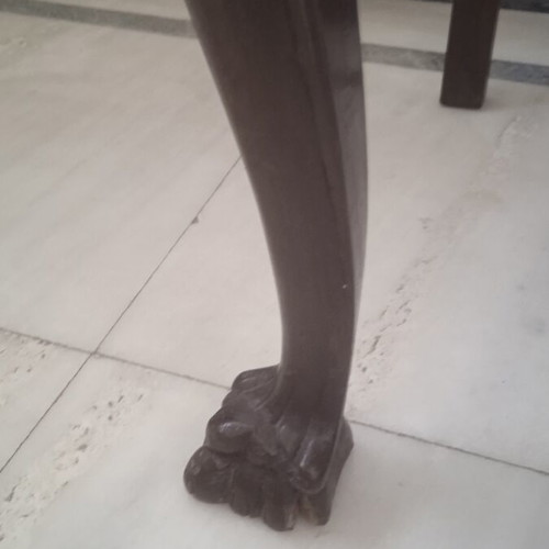 Antique chair used with lion's paw legs needing repair