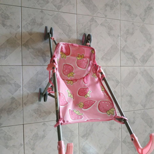 Doll stroller like new with 4 wheels