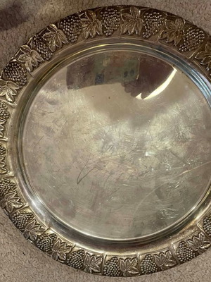 Round stainless steel tray with engravings like new