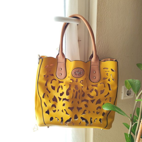 Yellow handbag used with beige details