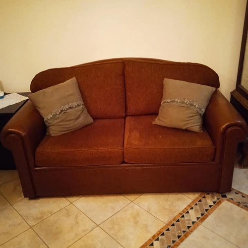 Two-seater sofa used, leatherette with fabric