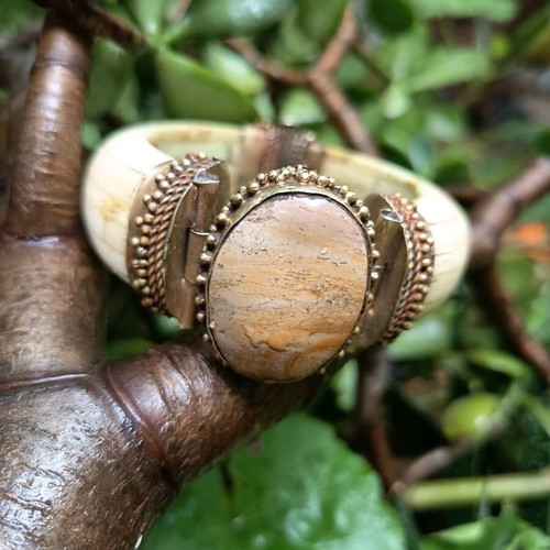 Boho bracelet used with bronze details beige