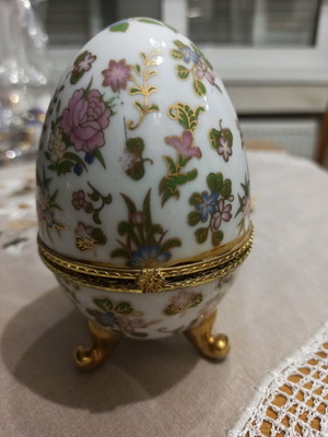 Decorative porcelain egg used with painted details
