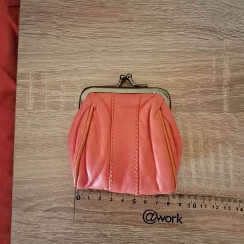 Wallet used, coral color, for coins or other use
