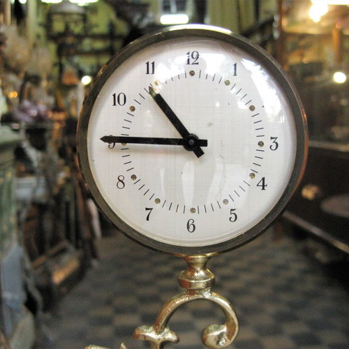 Brass tabletop clock used with decorative base