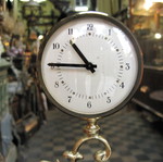 Brass tabletop clock used with decorative base