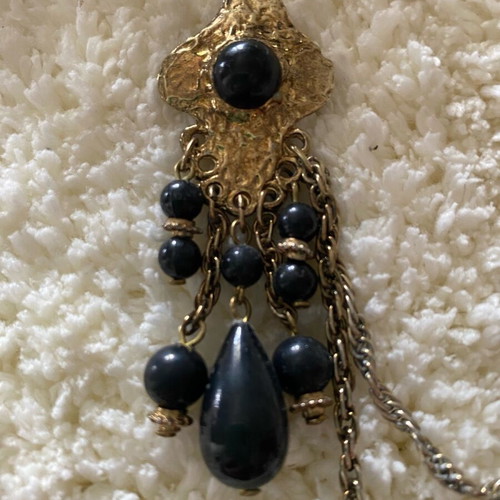 Vintage double brooch like new, gold color with black stones