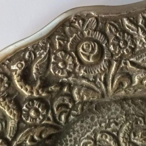 Silver-plated ashtray used, cast brass with decorative peacocks