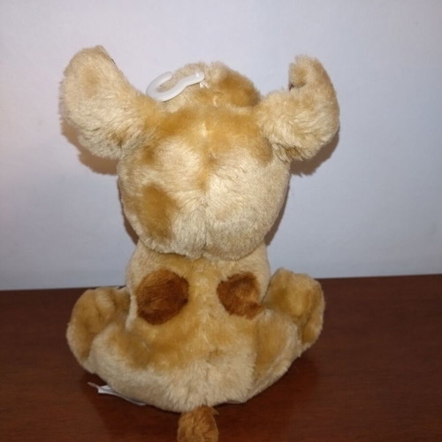 Plush dog used with red heart