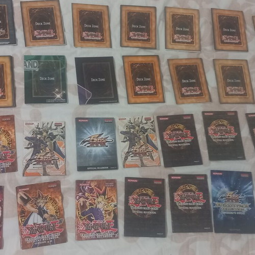 Yu-Gi-Oh! rule books and deck zones, like new, set of 14 each