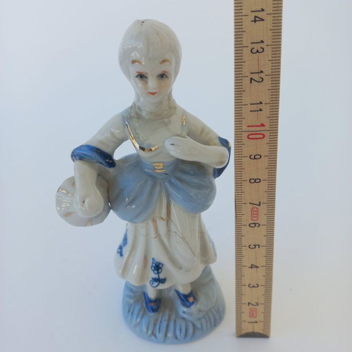 Porcelain figurine used with peasant girl