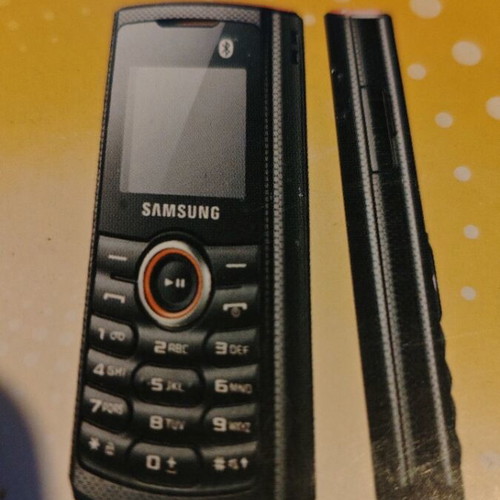 Samsung GT-E2121B mobile phone new with charger and headphones