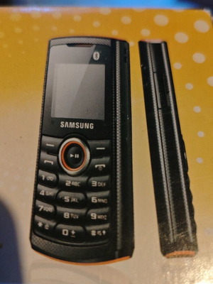 Samsung GT-E2121B mobile phone new with charger and headphones