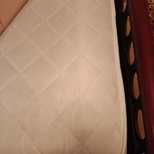 Double bed with two nightstands, mirror and unused mattress