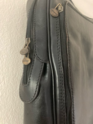 Black leather backpack used