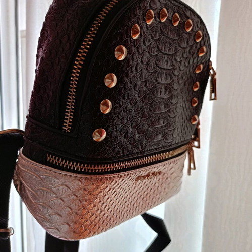 Small backpack like new, black and gold