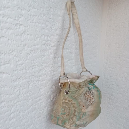 Shoulder bag in pouch style with leather details