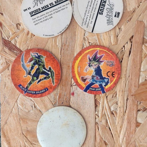 Set of 5 vintage collectible pogs from Spiderman, Yu Gi Oh and dinosaur collections
