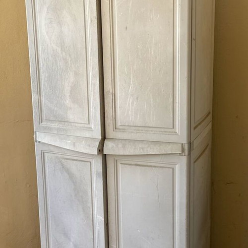 Keter plastic outdoor storage cabinet used, tall and functional