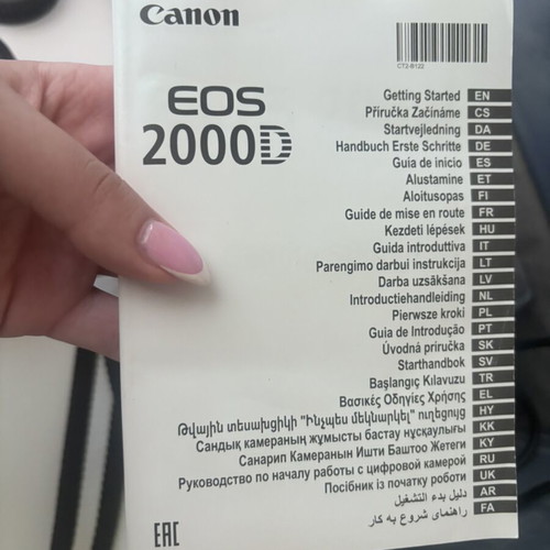 Canon EOS 2000D camera with case and tripod