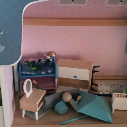 Wooden dollhouse used with extra accessories pack