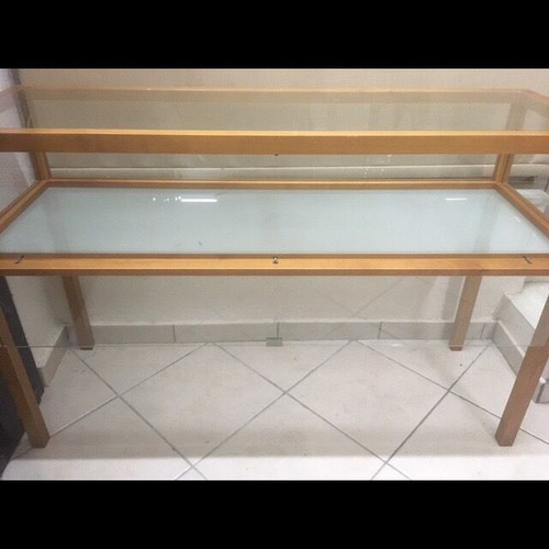 Console used with wooden frame and glass surfaces