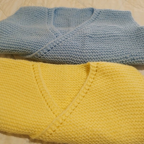 Handmade knitted baby sleeveless cardigans, yellow and blue