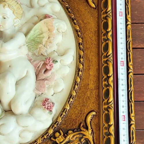 Relief wall art used in ornate frame 56x50cm