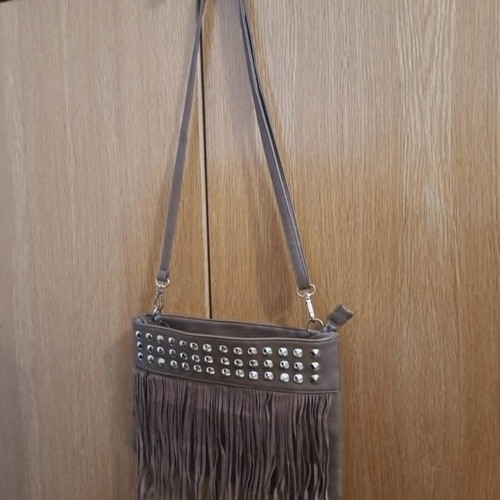 Brown synthetic suede crossbody bag with fringes and metal studs, boho style