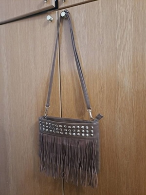 Brown synthetic suede crossbody bag with fringes and metal studs, boho style