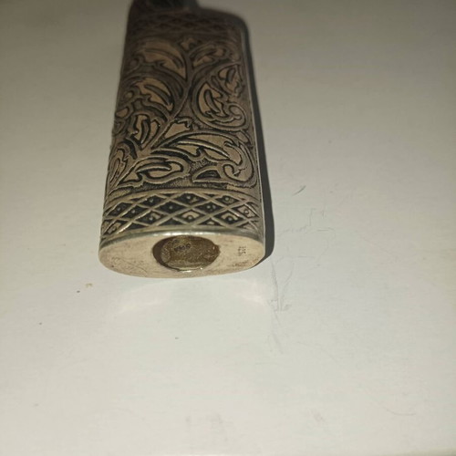 Vintage silver lighter case used with carved floral patterns