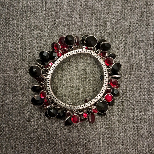 Bracelet with black and red stones adjustable size like new