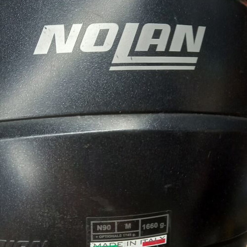 Nolan helmet used, flip-up with tinted visor and side communication