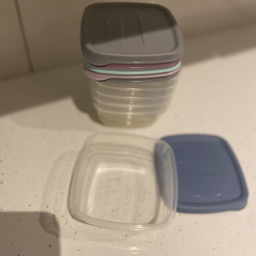 Set of small plastic food storage containers